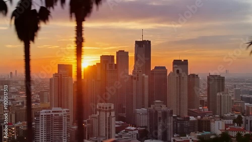 Wallpaper Mural Los angeles skyline at sunset with palm trees framing,beautiful golden hour light illuminating the city Torontodigital.ca