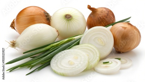 Fresh organic onions and raw garlic bulbs are isolated on a white background with ripe red tomatoes and green peppers as healthy vegetarian food ingredients for cooking