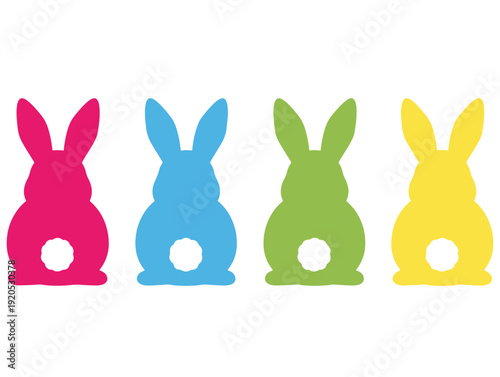 Colorful easter bunny figurines in red blue green and yellow