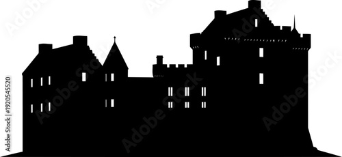 Historic castle complex silhouette with multiple turrets and battlements