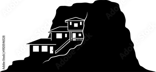 Residential building constructed into a natural rock cliff