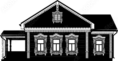 Russian traditional wooden house silhouette decorated with intricate window carvings
