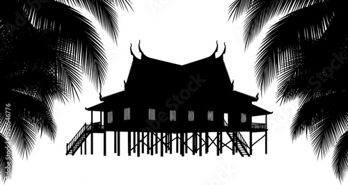 Thai stilt house silhouette framed by tropical palm leaves