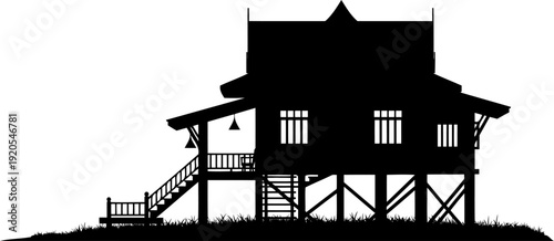 Thai wooden house on stilts silhouette with ladder