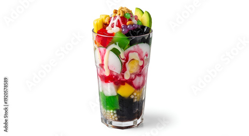 Vibrant Layers of Fruit and Sweets in a Clear Glass Container, a Colorful Dessert Displayed on a Neutral Background