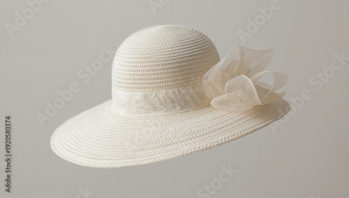 White Straw Hat With Flower Decoration on Light Background in Fashion Display