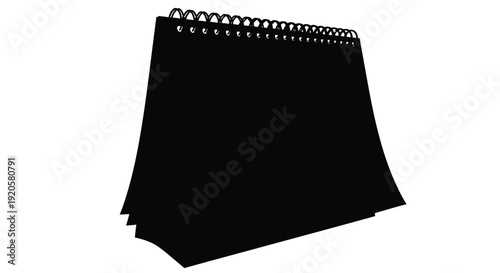 Black spiral notebook closed isolated on a white background with shadow