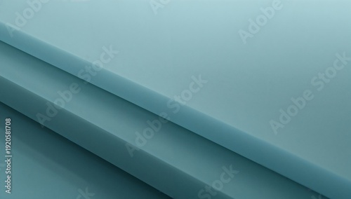 Soft Blue Fabric Draped in Folds on a Flat Surface Lighting up Under Soft Light