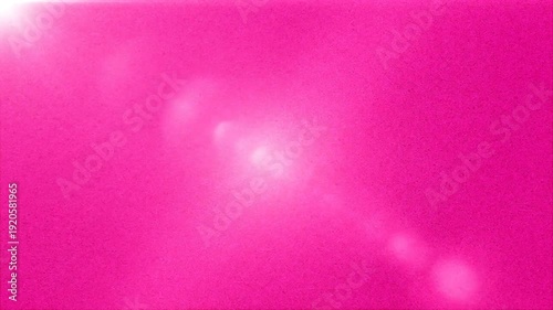 Vibrant pink background with lens flare and bokeh effect