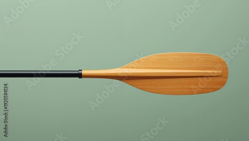 Wooden Paddle on a Plain Background Used for Canoeing or Rowing During Day