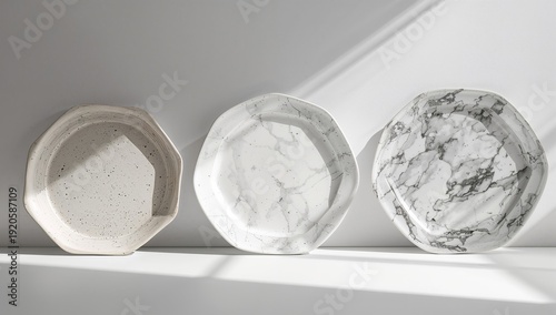 Collection of Three Different Plates Arranged on a Shelf With Natural Light