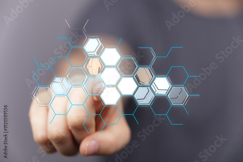 Hand touching hexagon-shape...