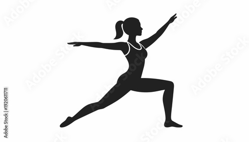 Woman practicing yoga in a warrior pose silhouette.