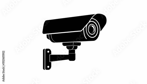 Black security camera mounted on wall bracket.
