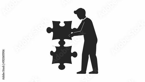 Man assembling puzzle pieces together.
