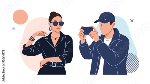 Fashion photographer taking a photo of a stylish woman posing in a black jumpsuit against an artistic background.