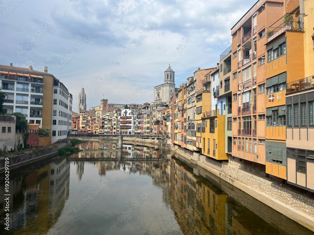 Fototapeta premium Scenic urban views of Catalonia featuring Girona’s iconic Iron Bridge, charming historic streets of Manresa, and picturesque corners of Balaguer, showcasing authentic architecture and vibrant local at