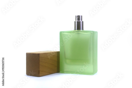 Perfume bottle on white background isolation. Green perfume bottle on white background isolation