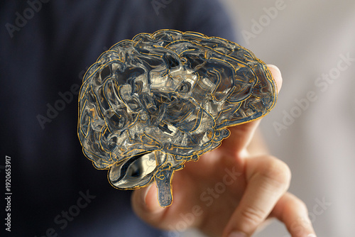 Hand holding a 3D glass bra...