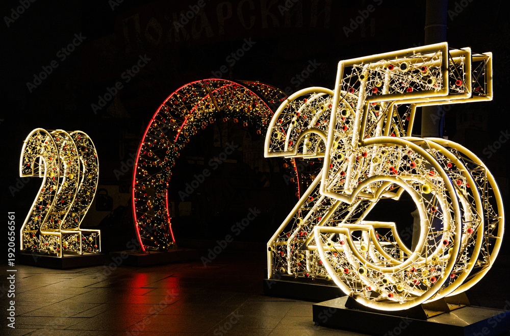 Ταπετσαρία Sparkling lights display announcing the year 2025 in a festive nighttime setting