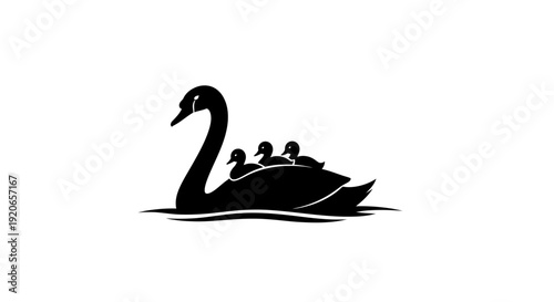 Black silhouette of a swan shaped boat with people inside on calm water.