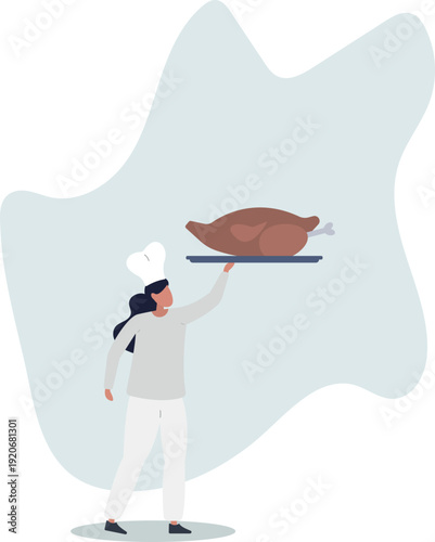 A female cook holds a tray with poultry meat in her hand.
