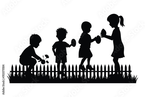 Silhouette of four children gardening and holding Easter eggs by a picket fence in Easter Sunday silhouette children playing black and white
