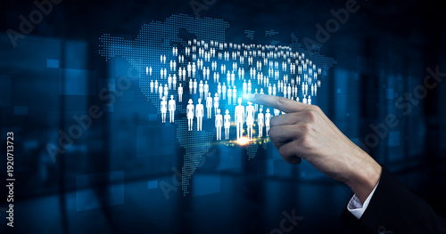 Business concept of digital connectivity with hand pointing at virtual global audience of users on a world map background in a high-tech environment Quark.