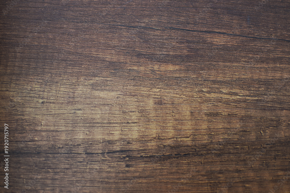 Obraz premium Natural wood texture background with detailed grain pattern. Rustic timber surface close up showing organic lines and warm brown tones.