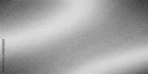 A shiny silver stainless steel plate featuring a brushed metal texture with a light metallic reflection on a gray aluminum surface pattern for a sleek industrial backdrop design