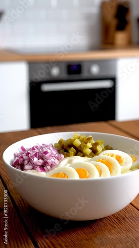 Boiled eggs with onion and olives.