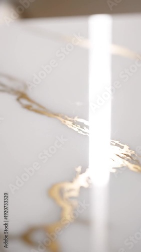 Blurry white marble with gold veins.