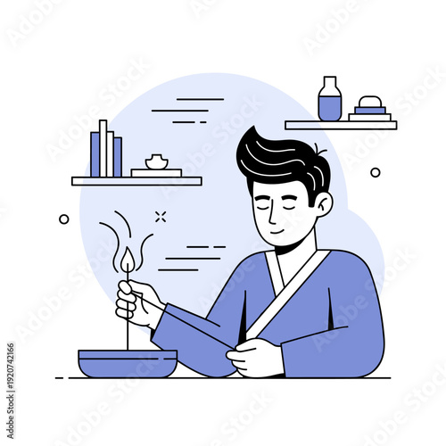 Young asian male in traditional attire practicing candle meditation in minimalist setting
