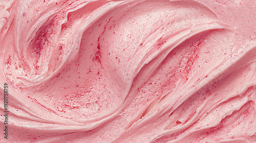 Pink buttercream frosting with swirls and texture, showcasing a smooth and creamy consistency ideal for cake decoration and dessert applications