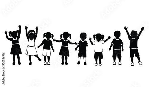 Silhouette of a group of happy children standing in a line with their arms raised in celebration