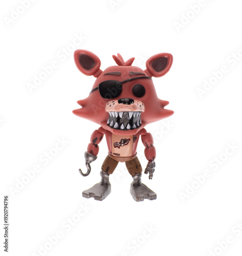 Plastic toy dog ​​pirate isolated on white background