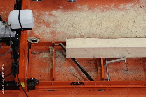 Fotografie Industrial wood planer machine in operation.