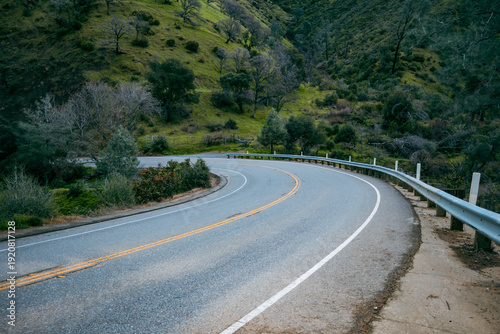Sharp curve on a rural mountain road through the California foothills