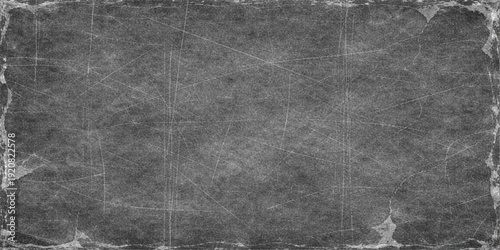 Old paper texture on a dark black and white grunge background with a rough aged stone pattern and gray concrete surface wallpaper