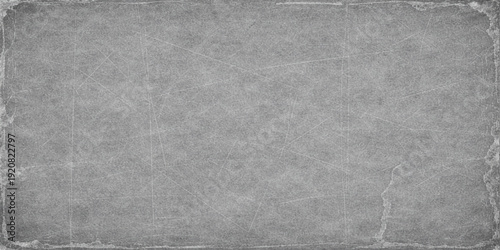 Old paper texture and vintage black and white chalk board design on a dark grunge canvas with a rough grey concrete wall pattern for a textured backdrop surface