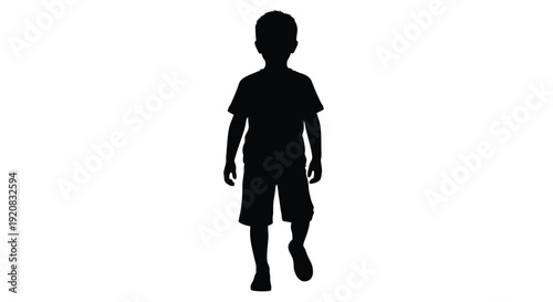 A full body view of a young boy in a dark silhouette