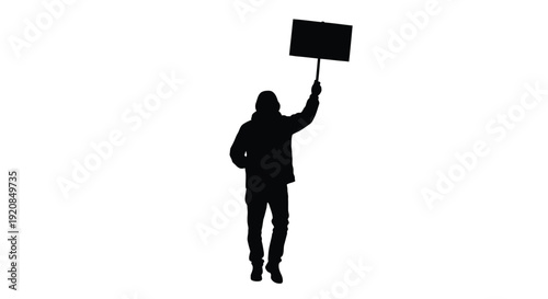 A person holding a blank sign aloft a striking silhouette