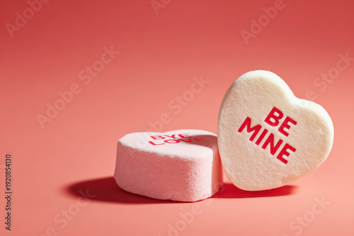 Conversation Hearts with BE MINE Message on Pink Background