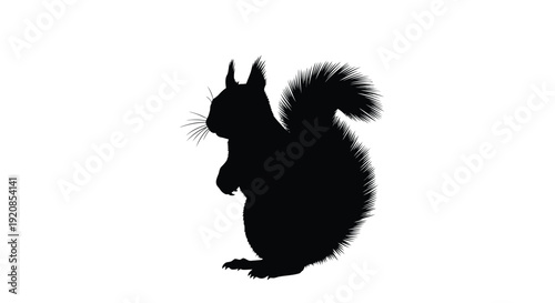 Black silhouette of a squirrel perched on hind legs detailed silhouette