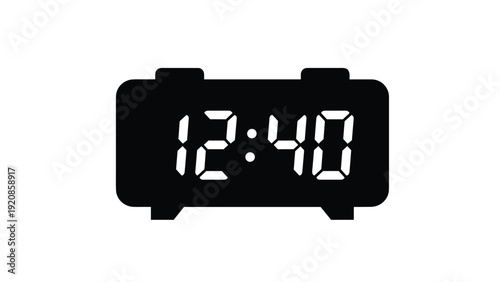 Digital alarm clock displaying 12:40 in white numbers on a black background, representing time management and scheduling.