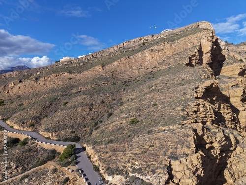 Φωτογραφία Bold sandstone cliff against sky, Imposing geological structure with detailed sh