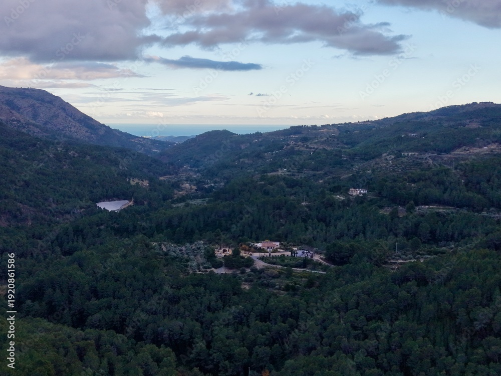 Fototapeta premium Serene landscape vista, Tranquil aerial perspective showcasing lush valleys and rolling hills