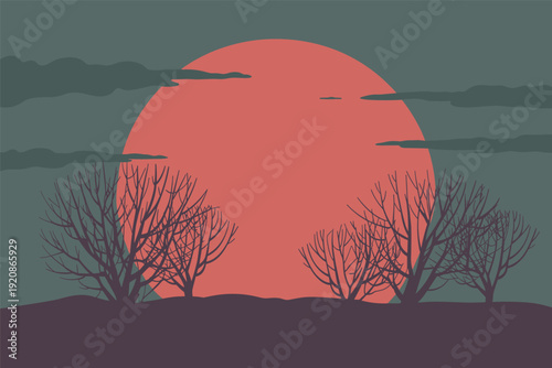 Vibrant sunset landscape with bare trees on hill