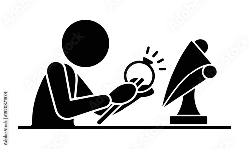 Person examining object with magnifying glass.