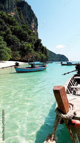 Peaceful tropical bay with anchored empty wooden boats